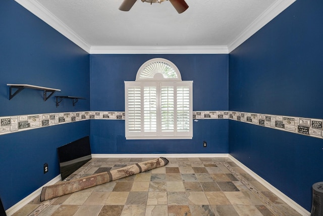 interior space with ceiling fan and crown molding