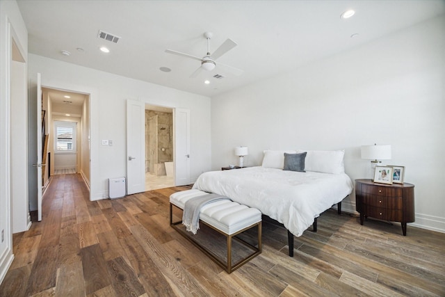 bedroom with connected bathroom, dark hardwood / wood-style floors, and ceiling fan