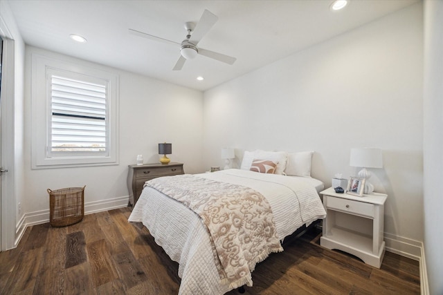 bedroom with ceiling fan and dark hardwood / wood-style floors