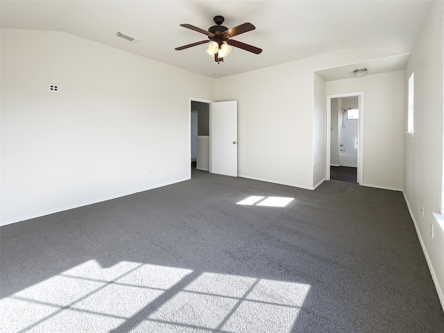 carpeted spare room with ceiling fan and lofted ceiling