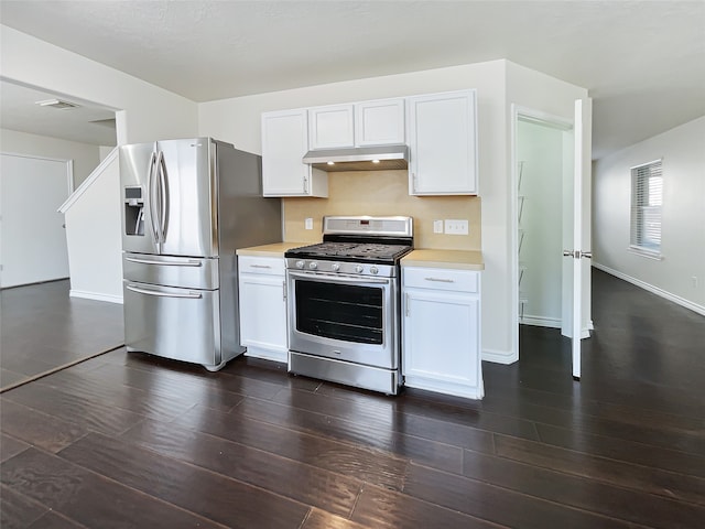 kitchen featuring dark hardwood / wood-style flooring, white cabinetry, and appliances with stainless steel finishes