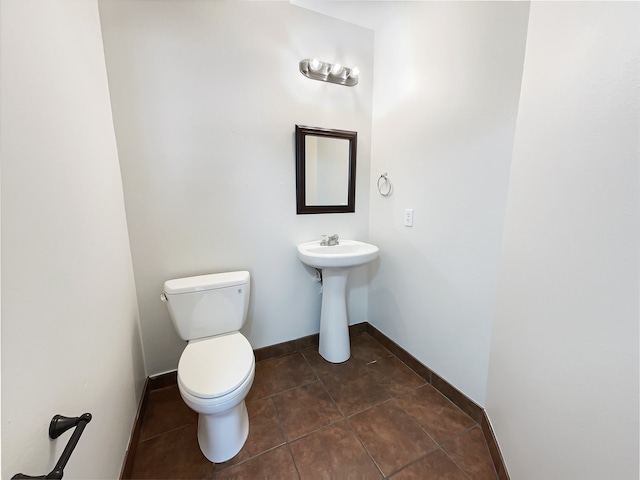 bathroom with tile patterned floors and toilet