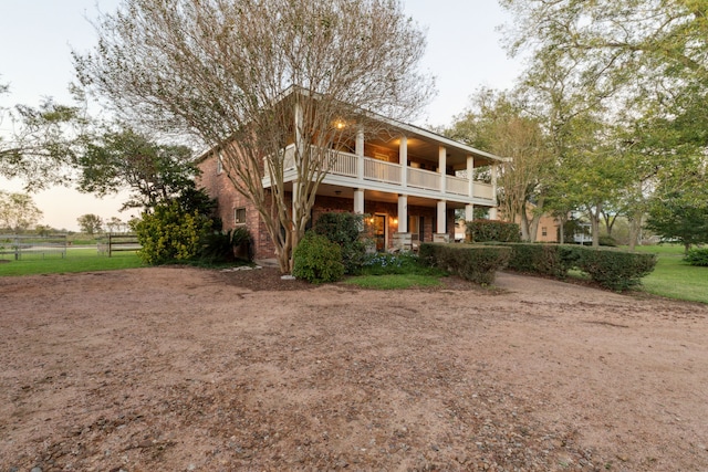 back of property with a balcony