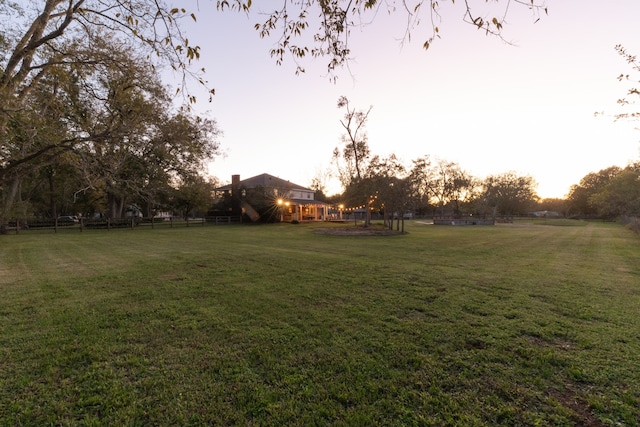 view of yard at dusk