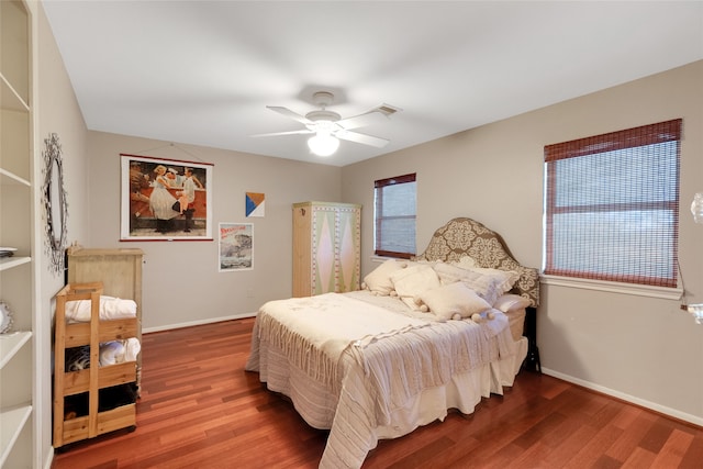 bedroom featuring hardwood / wood-style flooring and ceiling fan