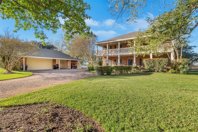 view of front of house featuring a balcony, a garage, a front lawn, and central air condition unit