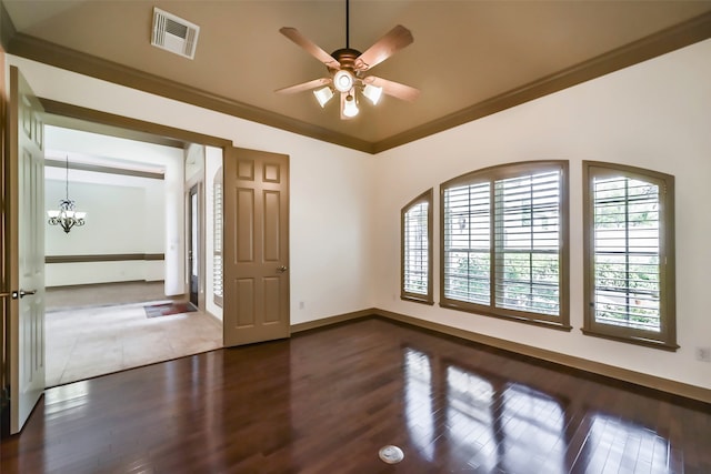 spare room with crown molding, dark wood-type flooring, and ceiling fan with notable chandelier