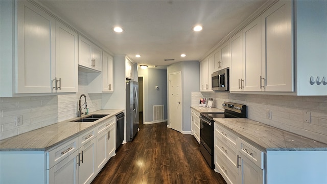 kitchen with white cabinetry, sink, dark wood-type flooring, and appliances with stainless steel finishes