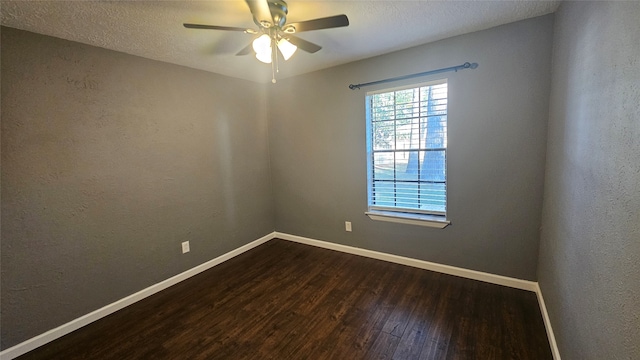 spare room featuring a textured ceiling, dark hardwood / wood-style flooring, and ceiling fan