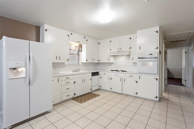 kitchen featuring white cabinets, light tile patterned flooring, white appliances, and sink