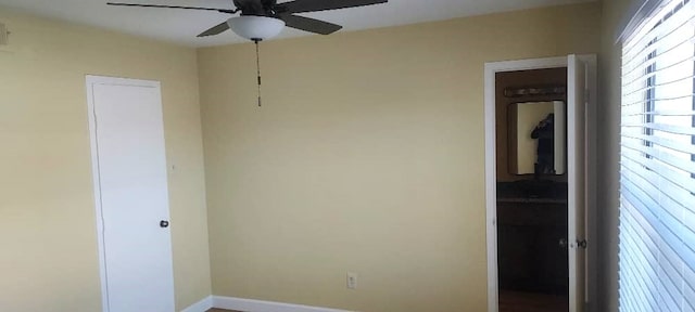 unfurnished room with ceiling fan