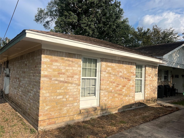 view of side of home featuring a patio area