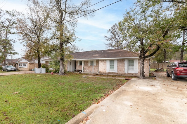 ranch-style home with a front lawn