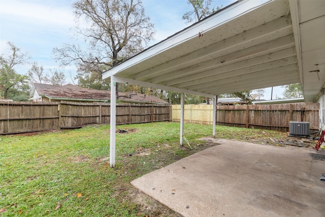 view of yard with cooling unit and a patio area