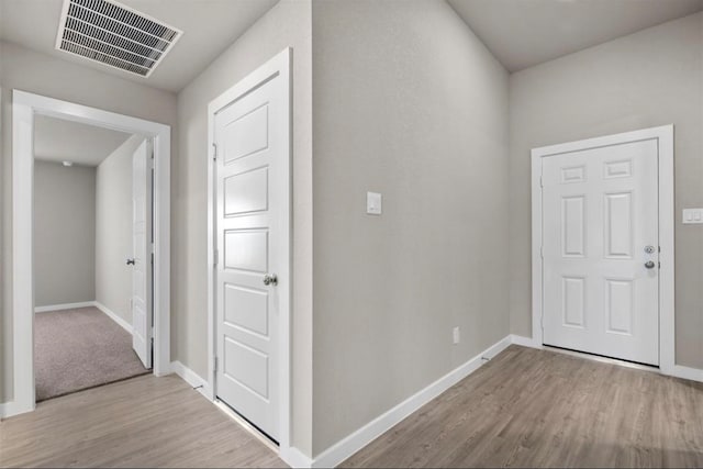 hallway featuring light hardwood / wood-style flooring