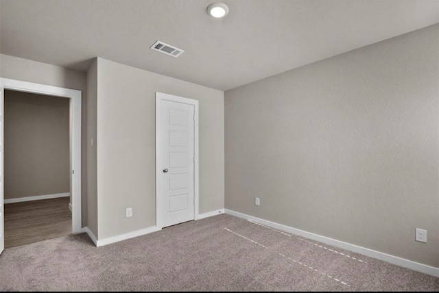 unfurnished bedroom with carpet and a closet