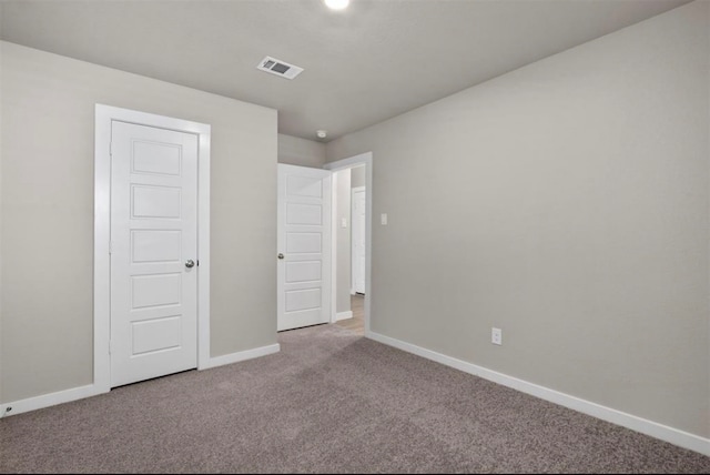 unfurnished bedroom featuring carpet