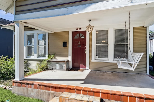 doorway to property with covered porch