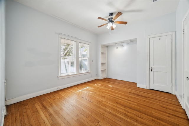 unfurnished bedroom featuring light hardwood / wood-style floors and ceiling fan