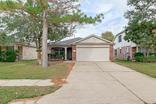 view of front of house featuring a garage and a front lawn