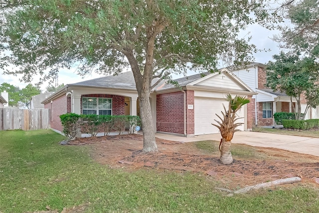 ranch-style house featuring a front yard and a garage