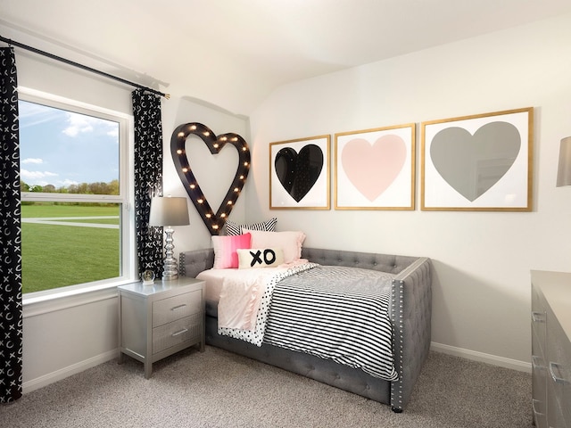 carpeted bedroom with lofted ceiling