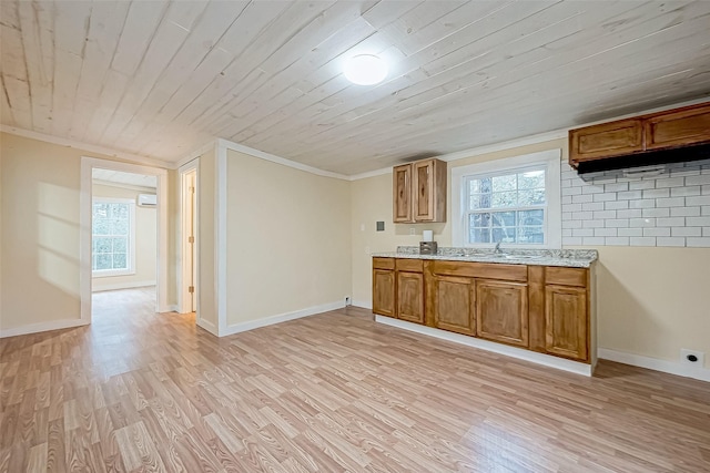 kitchen with crown molding, light wood-type flooring, sink, and wood ceiling