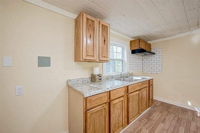 kitchen with backsplash, sink, light hardwood / wood-style flooring, ornamental molding, and wood ceiling