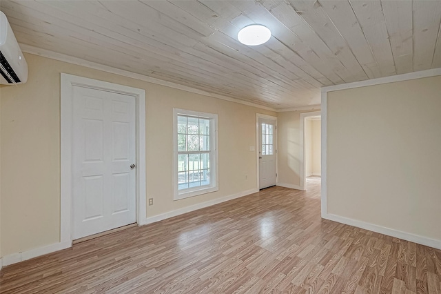 spare room featuring light hardwood / wood-style floors, a wall mounted AC, and wood ceiling