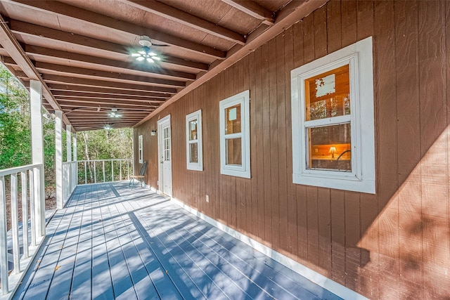 wooden deck featuring ceiling fan