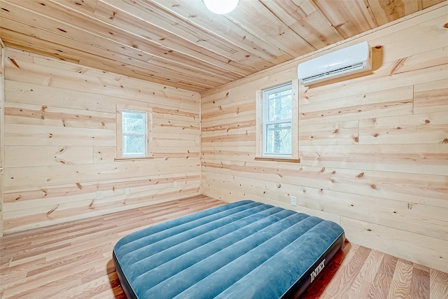 bedroom with a wall mounted air conditioner, wood-type flooring, wooden ceiling, and wood walls