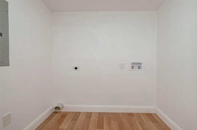 laundry area with washer hookup, hookup for an electric dryer, electric panel, and light hardwood / wood-style flooring