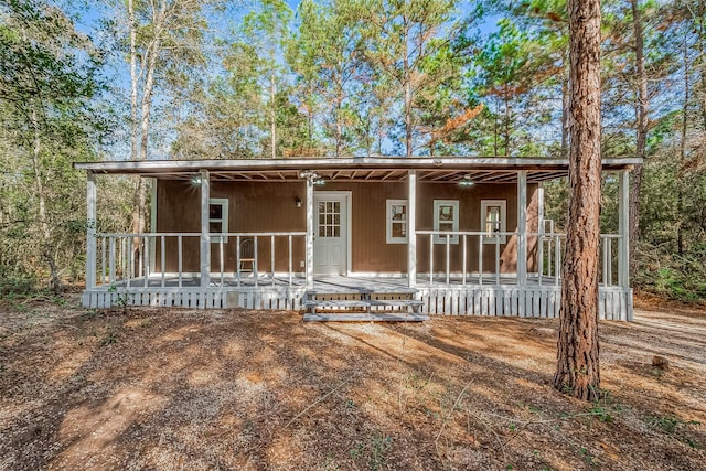 back of property featuring a porch