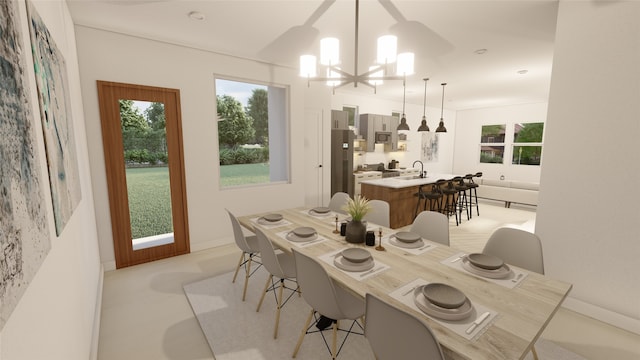 dining space with sink and a chandelier