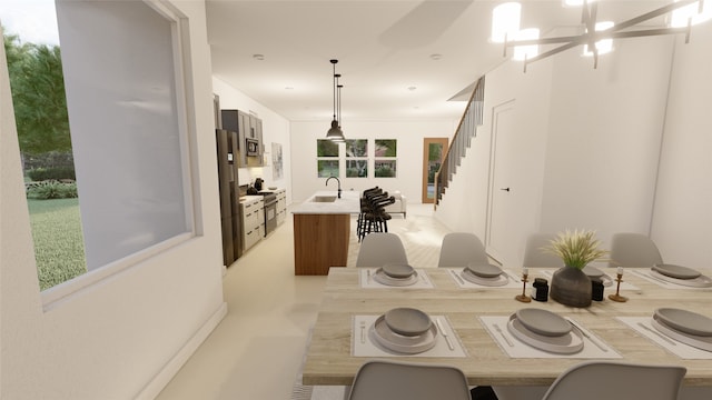 dining area with a notable chandelier and sink