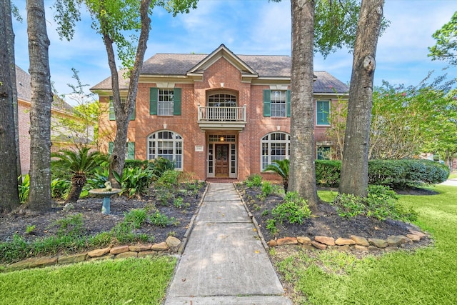 view of front of house featuring a balcony