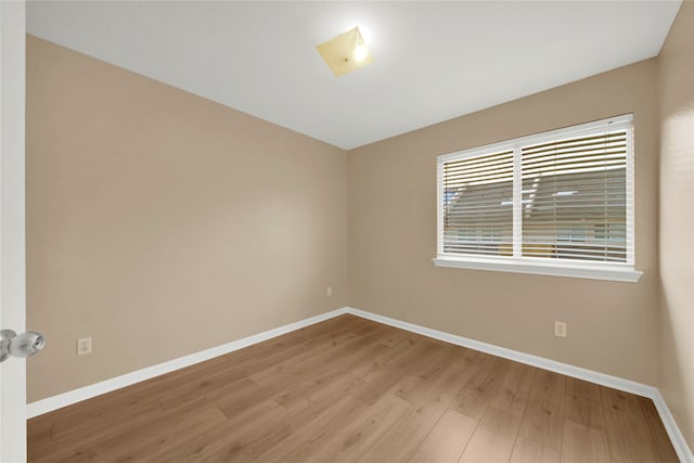 empty room with light hardwood / wood-style floors