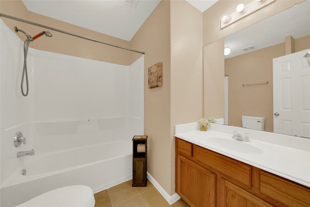 full bathroom featuring toilet, vanity, tile patterned floors, and washtub / shower combination