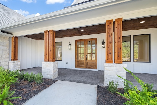 view of exterior entry with a porch