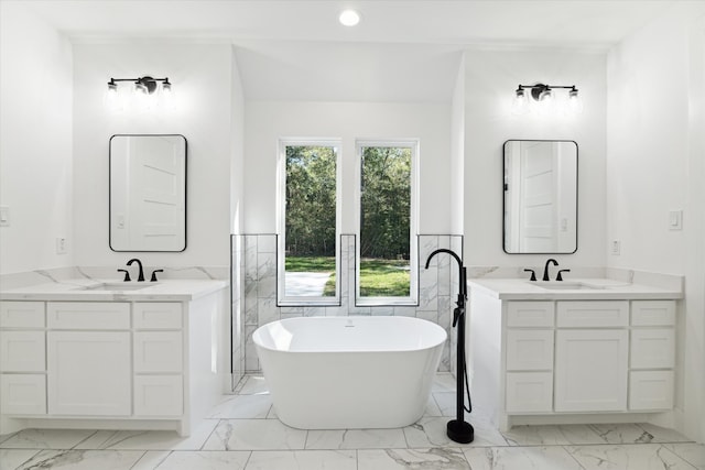 bathroom featuring vanity and a bathing tub