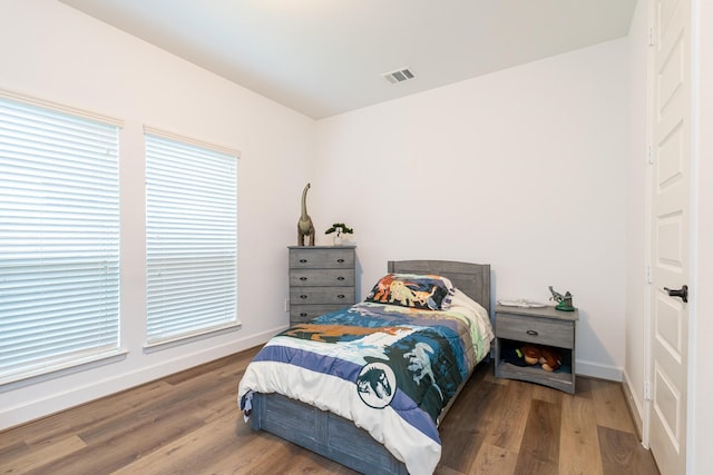 bedroom with wood-type flooring