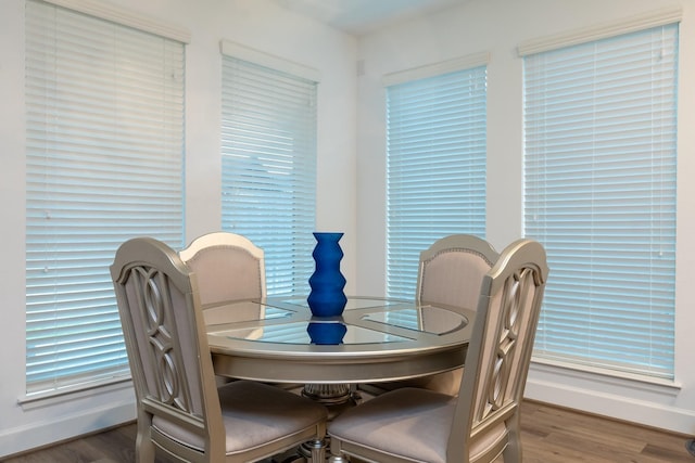 dining space with dark wood-type flooring