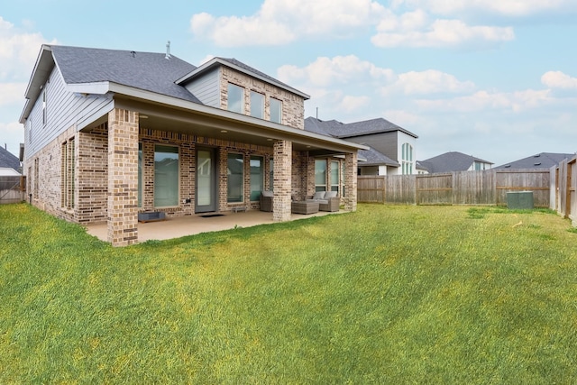 back of house with a yard, a patio area, and outdoor lounge area