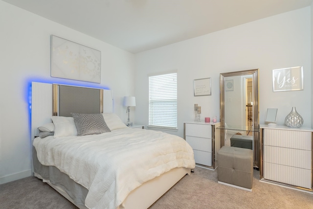 bedroom with light colored carpet