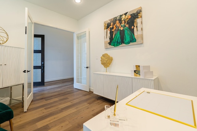 bedroom featuring dark wood-type flooring and french doors