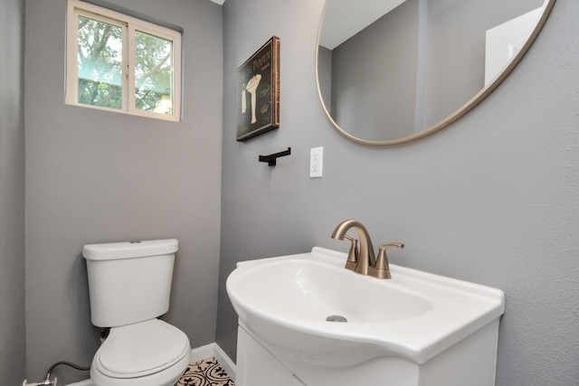 bathroom featuring toilet and sink