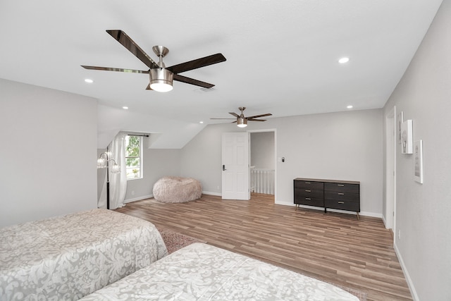 bedroom with ceiling fan and wood-type flooring