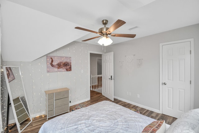 bedroom featuring ceiling fan and dark hardwood / wood-style flooring