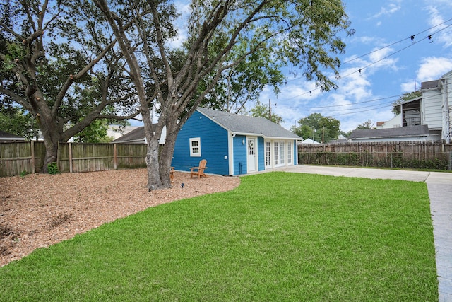 view of yard featuring a patio area and french doors