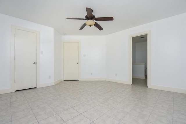 spare room with ceiling fan